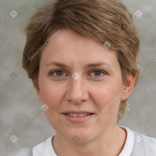 Joyful white adult female with short  brown hair and grey eyes