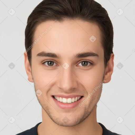 Joyful white young-adult male with short  brown hair and brown eyes