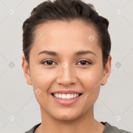 Joyful white young-adult female with short  brown hair and brown eyes