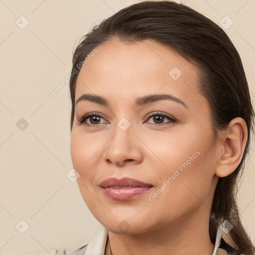 Joyful white young-adult female with long  brown hair and brown eyes