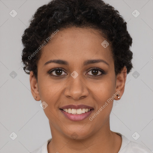 Joyful black young-adult female with short  brown hair and brown eyes