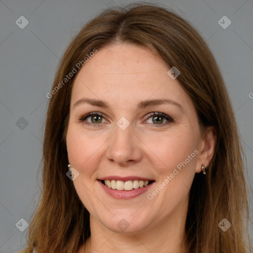 Joyful white adult female with long  brown hair and brown eyes