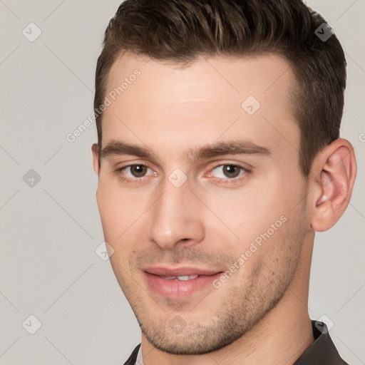 Joyful white young-adult male with short  brown hair and brown eyes