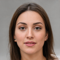 Joyful white young-adult female with medium  brown hair and green eyes