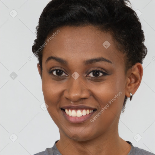 Joyful latino young-adult female with short  brown hair and brown eyes