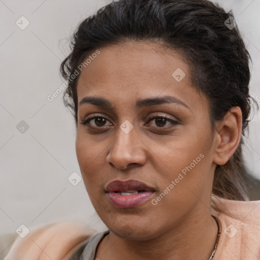 Joyful latino young-adult female with short  brown hair and brown eyes