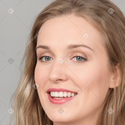 Joyful white young-adult female with long  brown hair and grey eyes