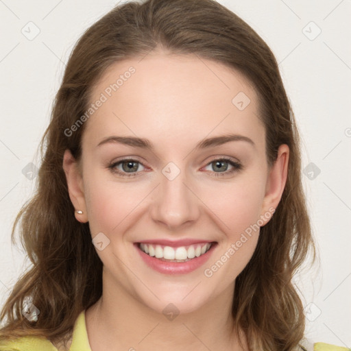 Joyful white young-adult female with long  brown hair and green eyes