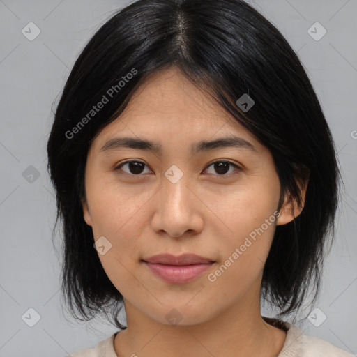 Joyful asian young-adult female with medium  black hair and brown eyes