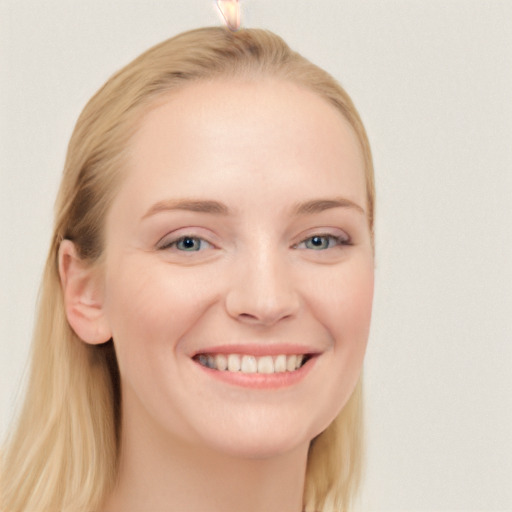 Joyful white young-adult female with long  brown hair and blue eyes