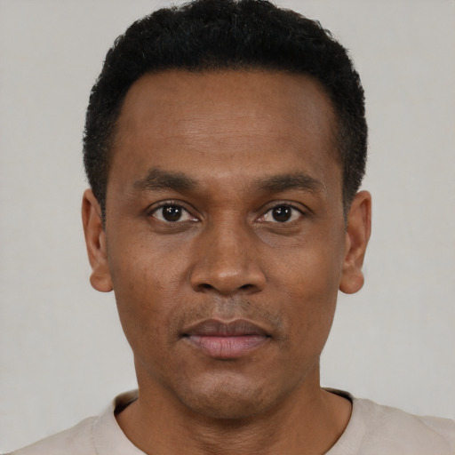 Neutral black young-adult male with short  black hair and brown eyes