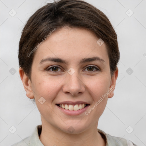 Joyful white young-adult female with short  brown hair and grey eyes