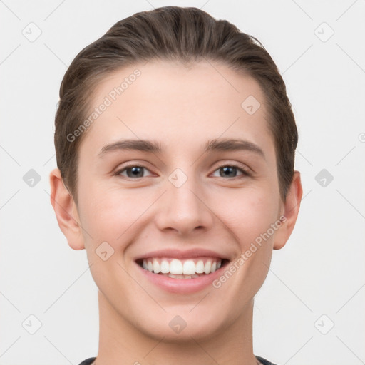 Joyful white young-adult female with short  brown hair and brown eyes