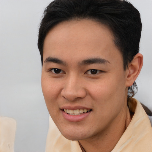 Joyful asian young-adult female with short  brown hair and brown eyes