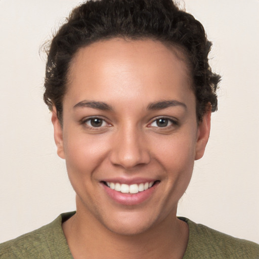 Joyful white young-adult female with short  brown hair and brown eyes