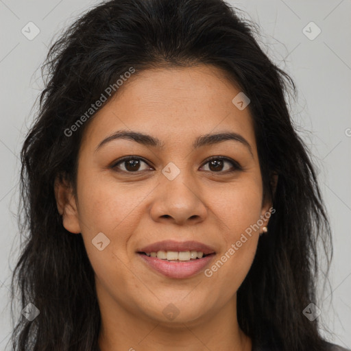 Joyful latino young-adult female with long  brown hair and brown eyes