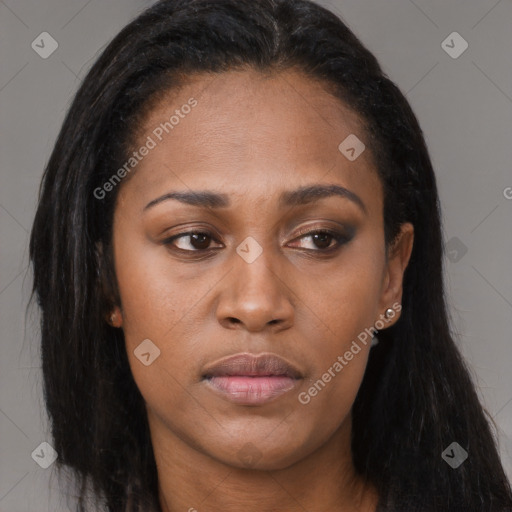 Joyful black young-adult female with long  brown hair and brown eyes