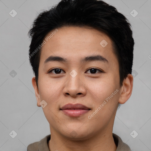 Joyful asian young-adult male with short  brown hair and brown eyes