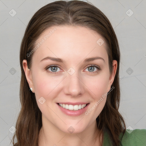 Joyful white young-adult female with long  brown hair and blue eyes