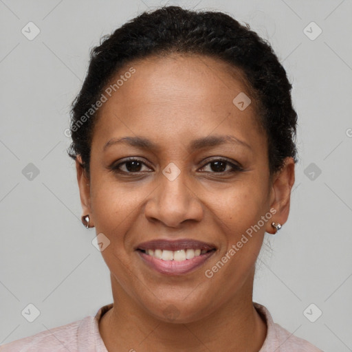 Joyful black adult female with short  brown hair and brown eyes