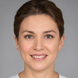 Joyful white young-adult female with short  brown hair and brown eyes