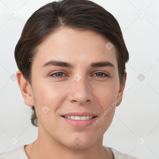 Joyful white young-adult female with short  brown hair and grey eyes