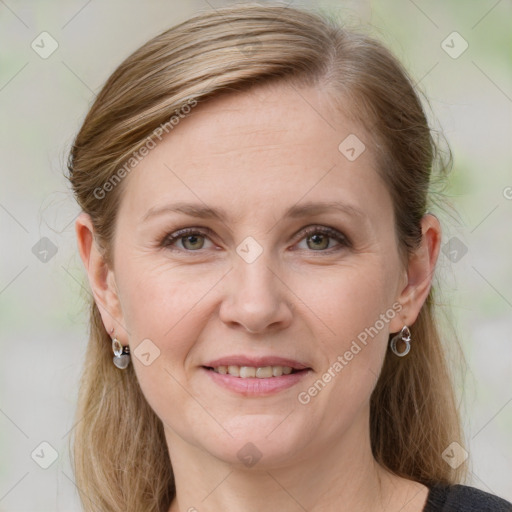 Joyful white adult female with medium  brown hair and grey eyes