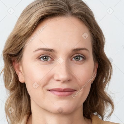 Joyful white young-adult female with medium  brown hair and green eyes