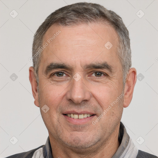 Joyful white adult male with short  brown hair and brown eyes