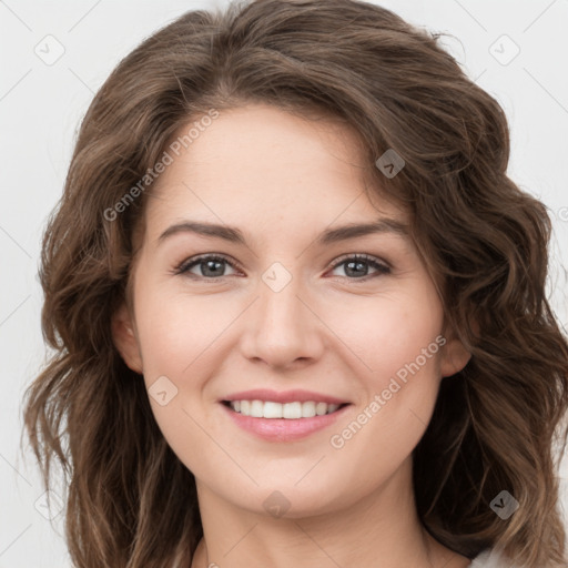 Joyful white young-adult female with long  brown hair and green eyes