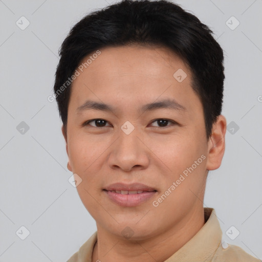 Joyful asian young-adult male with short  brown hair and brown eyes