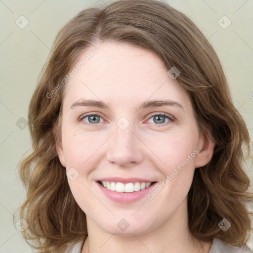 Joyful white young-adult female with medium  brown hair and green eyes