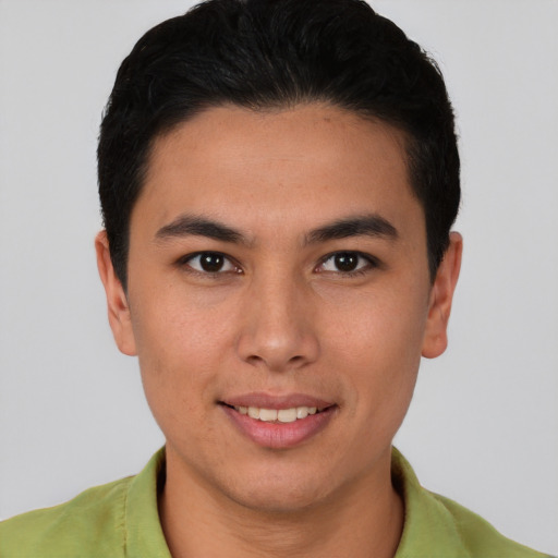 Joyful asian young-adult male with short  brown hair and brown eyes