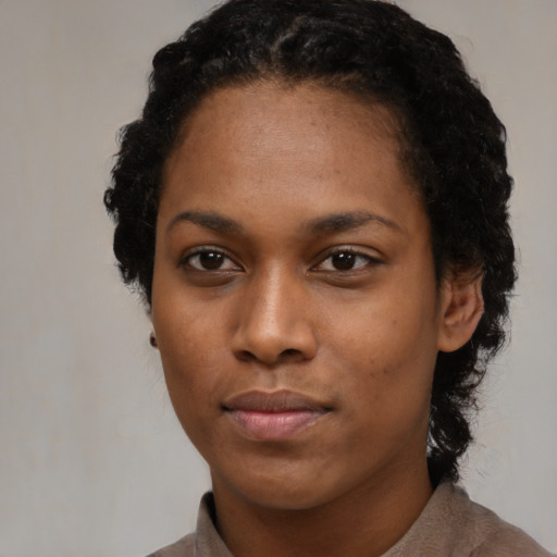 Neutral black young-adult female with short  black hair and brown eyes