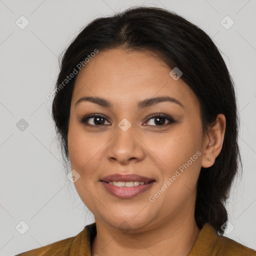 Joyful latino young-adult female with medium  brown hair and brown eyes