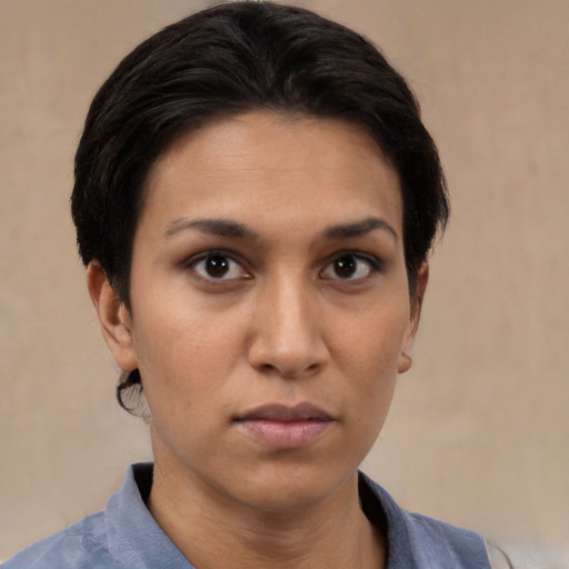 Neutral white young-adult female with short  black hair and brown eyes
