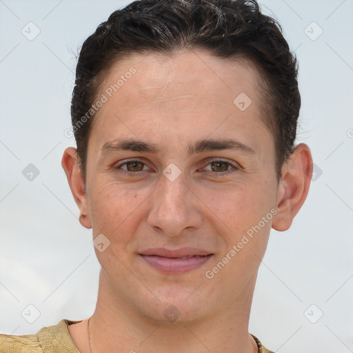 Joyful white young-adult male with short  brown hair and brown eyes