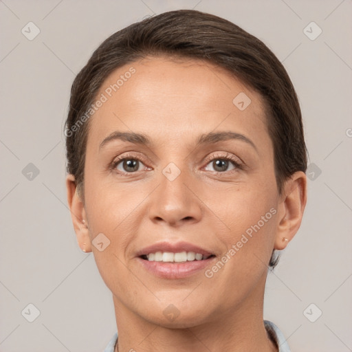 Joyful white adult female with short  brown hair and brown eyes