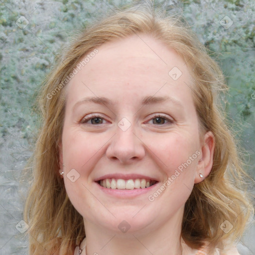 Joyful white young-adult female with medium  brown hair and blue eyes