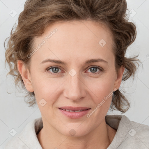 Joyful white young-adult female with medium  brown hair and blue eyes