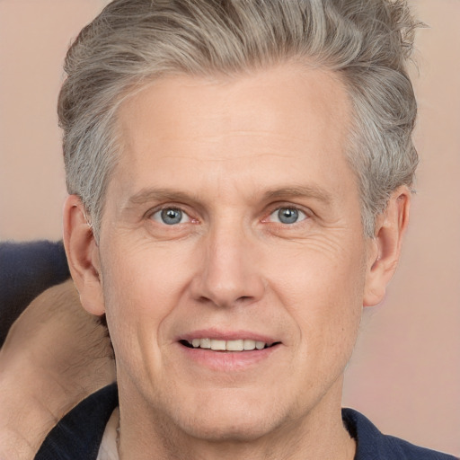 Joyful white adult male with short  brown hair and grey eyes