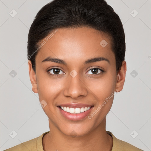 Joyful latino young-adult female with short  brown hair and brown eyes