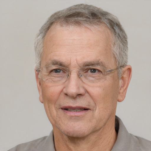 Joyful white middle-aged male with short  gray hair and brown eyes