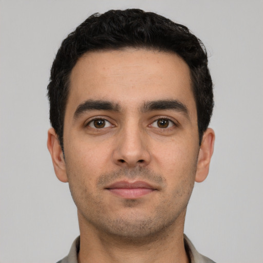 Neutral white young-adult male with short  black hair and brown eyes