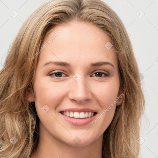 Joyful white young-adult female with long  brown hair and green eyes