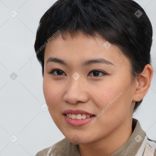 Joyful asian young-adult female with short  brown hair and brown eyes