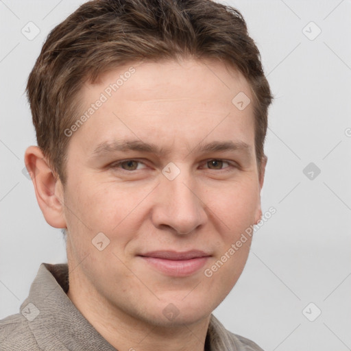 Joyful white adult male with short  brown hair and grey eyes