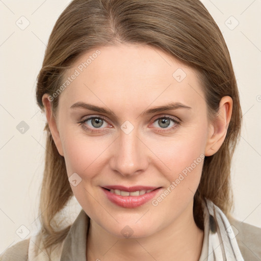 Joyful white young-adult female with medium  brown hair and blue eyes