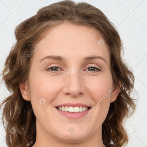 Joyful white young-adult female with medium  brown hair and green eyes