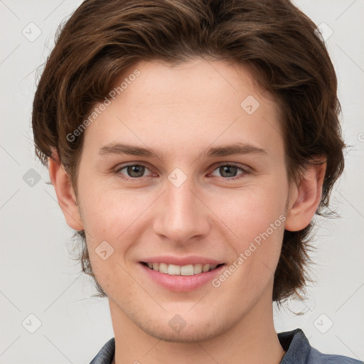 Joyful white young-adult female with short  brown hair and grey eyes